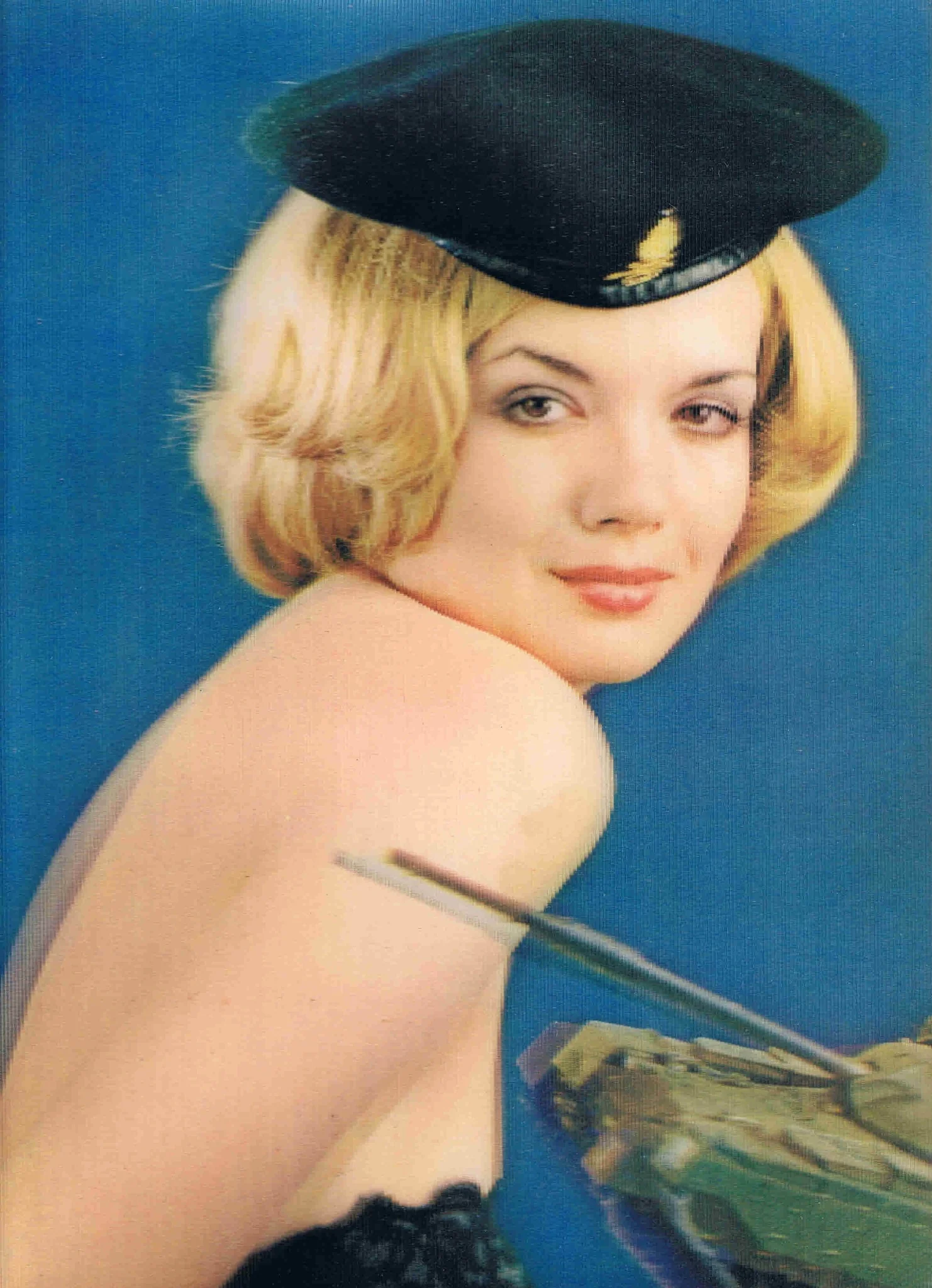 3D postcard featuring a blonde woman in a black hat against a blue background